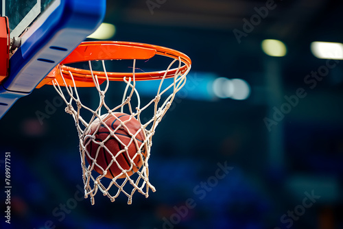 Close-up of a basketball swishing through the net, capturing the decisive moment in a dynamic game