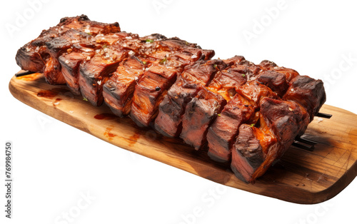 A large piece of meat resting on a wooden cutting board