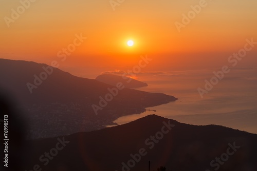 Beautiful mountain landscape with sunset sky with sea