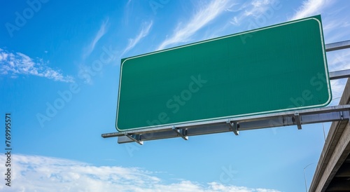 A blank highway sign with green background on the right side of an overpass, isolated against blue sky Generative AI