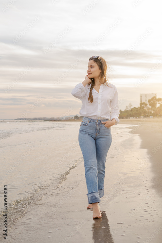 A thoughtful Venezuelan woman enjoys a tranquil walk by the sea at dusk, the gentle waves brushing against her bare feet A thoughtful Venezuelan woman enjoys a tranquil walk by the sea at dusk, the gentle waves brushing against her bare feet