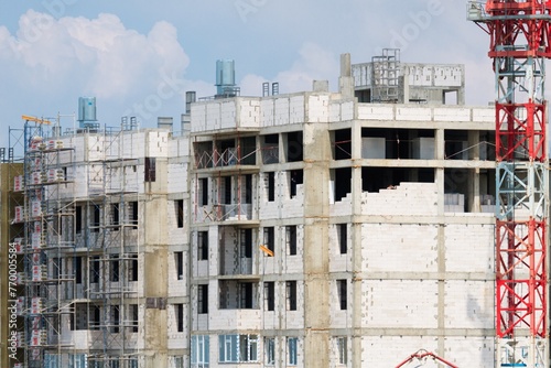 The architectural complex of residential buildings on sky background