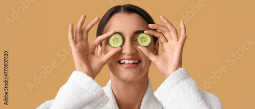 Young woman with cucumber s...