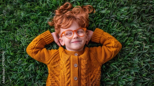Young Girl With Glasses Relaxing on Grass