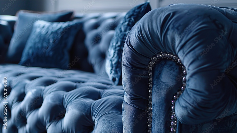 Obraz premium A detailed shot of a luxurious velvet sofa, featuring deep tufting, rolled arms, and plush cushions, inviting relaxation and comfort in a modern living room.
