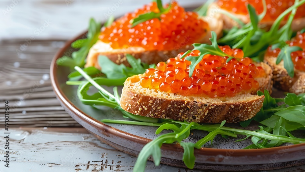 Red caviar toasts. Bruschetta with red caviar in a plate on a wooden table Red caviar toasts. Bruschetta with red caviar in a plate on a wooden table