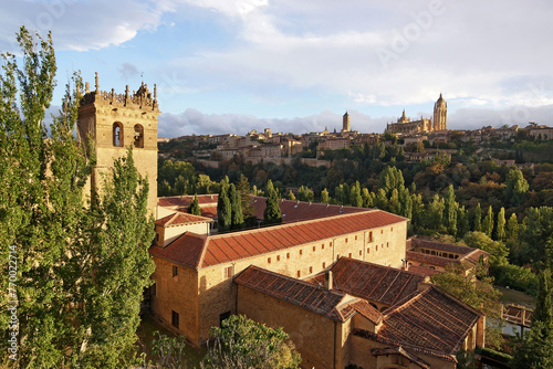 Panoramic view in the historic city of Segovia from the Jerónimos Monastery  at sunset , Spain photo