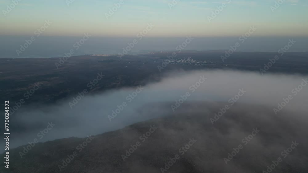Expansive view of clouds over the dramatic landscape of Fuerteventura, Canary island in spain Expansive view of clouds over the dramatic landscape of Fuerteventura, Canary island in spain