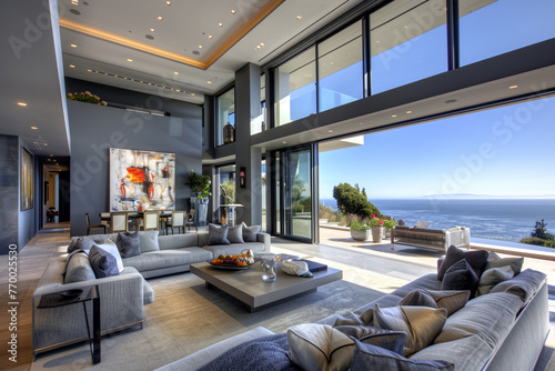 A sophisticated slate grey house with luxury furnishings, an art collection, and expansive terraces with ocean views. / photo