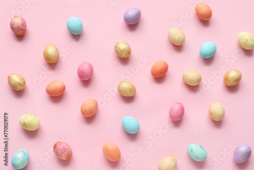 Painted Easter eggs on pink background