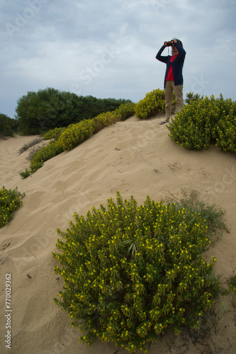 woman exploring the dunes in ingurtosu. Iglesias, Sardinia, Italy photo