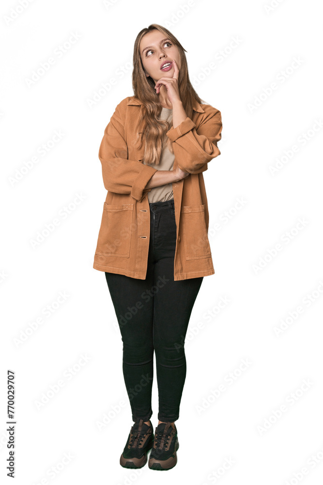 Studio portrait of a blonde Caucasian woman looking sideways with doubtful and skeptical expression. Studio portrait of a blonde Caucasian woman looking sideways with doubtful and skeptical expression.
