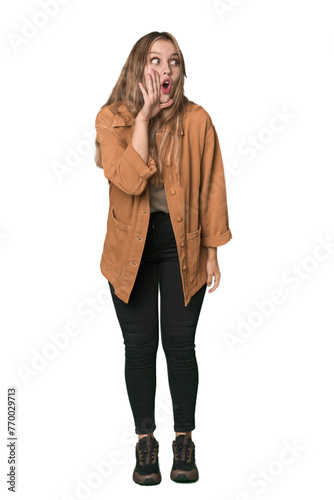 Studio portrait of a blonde Caucasian woman is saying a secret hot braking news and looking aside