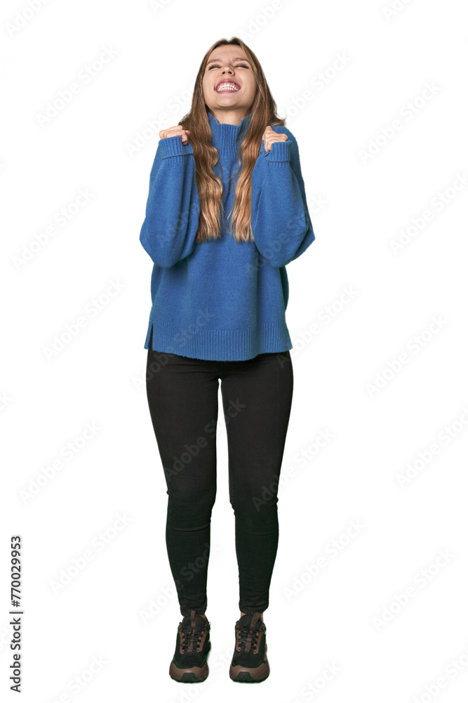 Studio portrait of a blonde Caucasian woman celebrating a victory, passion and enthusiasm, happy expression. Studio portrait of a blonde Caucasian woman celebrating a victory, passion and enthusiasm, happy expression.