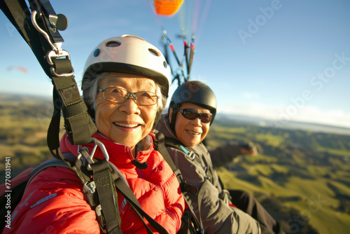 Active senior couple paragliding