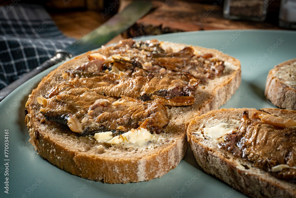 Slices of multigrain bread with sprats. Slices of multigrain bread with sprats.