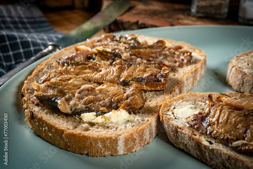 Slices of multigrain bread with sprats.