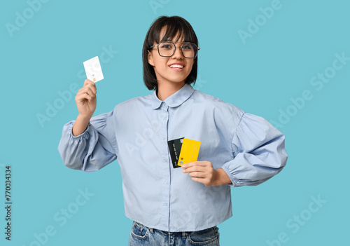 Smiling young woman holding...
