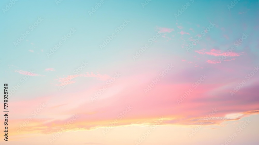 Soothing pastel sunset sky with delicate pink and blue hues and wispy clouds, conveying peace and serenity