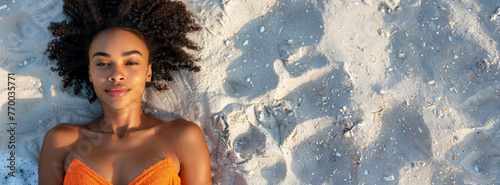 Woman in Orange Bathing Suit Relaxing on Beach