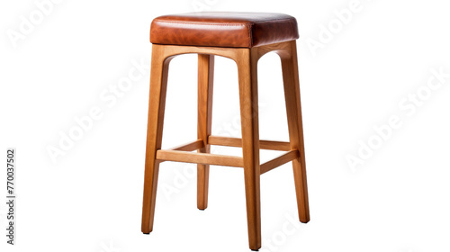 A wooden stool with a rich brown leather seat, showcasing a blend of traditional craftsmanship and elegance