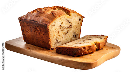 A loaf of bread sits atop a wooden cutting board, ready to be sliced for a homemade meal