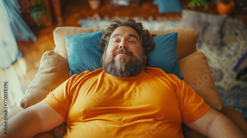 Happy man relaxing in the chair at home