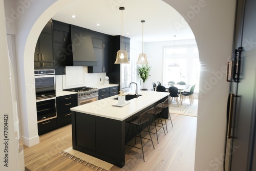 all black kitchen has countertops and flooring © ASDF