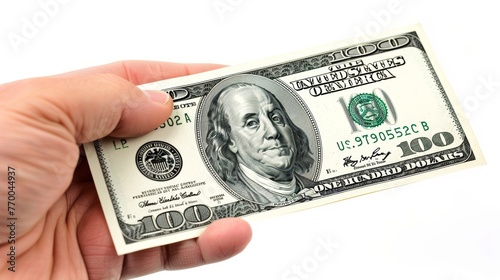 Hand presenting a one hundred dollar bill on a white background. Monetary transaction and cash handling concept photo