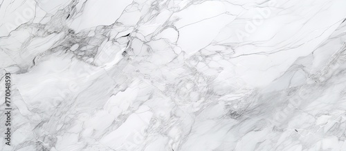 A closeup shot of a freezing white marble texture, resembling a snowcovered slope. The intricate patterns create a monochrome photography event in the midst of winter, with cumulus clouds overhead photo