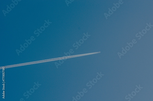 Sky, cloudless weather. An airplane trail in the sky