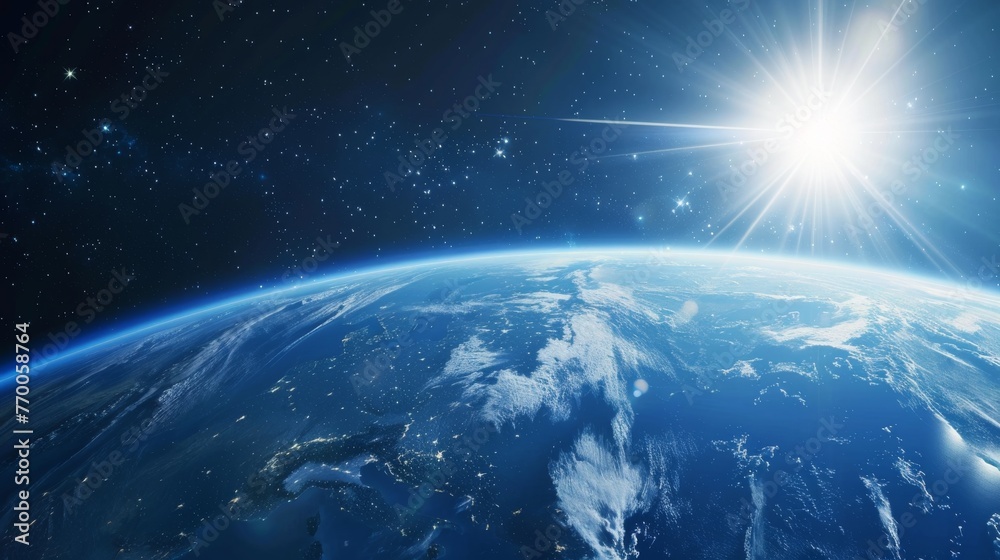 Fototapeta premium An image of Earth viewed from space, featuring the sun rising above the horizon line