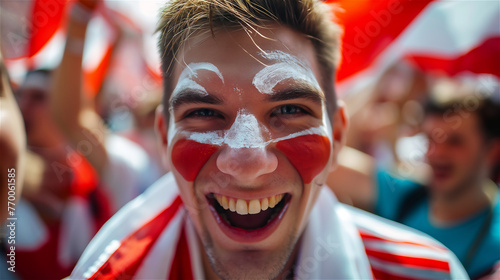 Obraz na płótnie A cheerful fan of the national team with a cheering crowd in the background. w salonie