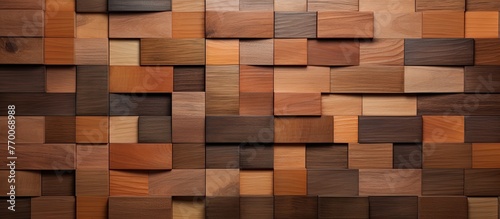 A close up of a brown rectangular wooden wall made of wooden blocks resembling brick. The hardwood wall has a wood stain and is similar to flooring or shelving materials with various tints and shades