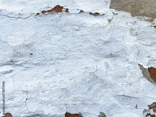 Close-up of a white old cracked wall
