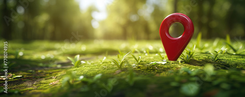 A vibrant red location pin icon stands out in a sunlit, verdant forest, symbolizing geolocation and nature exploration.