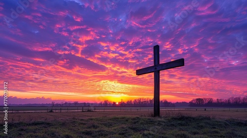A powerful photograph of a cross silhouetted against a vibrant sunrise, conveying the significance of the cross in the Christian faith and the promise of redemption