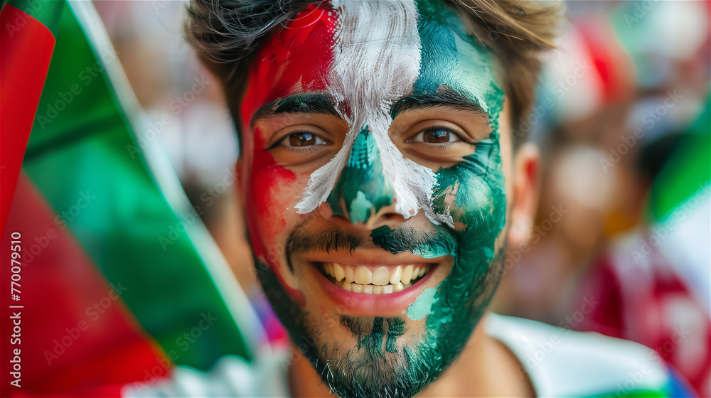 A cheerful fan of the national team with a cheering crowd in the background.