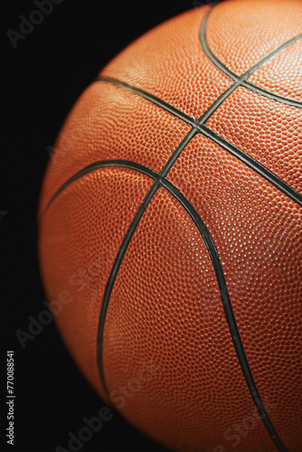 Basketball ball on a black background close-up blur, sports background