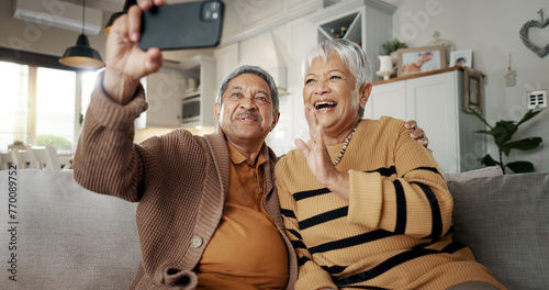 Senior couple, selfie and smile on sofa, hug and bonding with love, support and relax in retirement in home. Elderly woman, old man and happy with profile profile, web blog and social media on couch