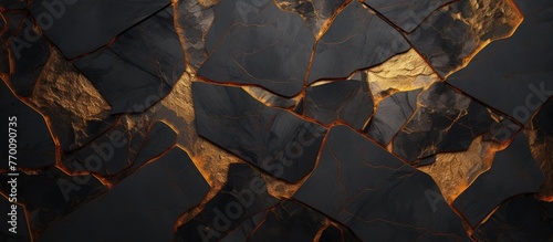 Close-up view of a textured black and gold marble wall showcasing its intricate cracky surface