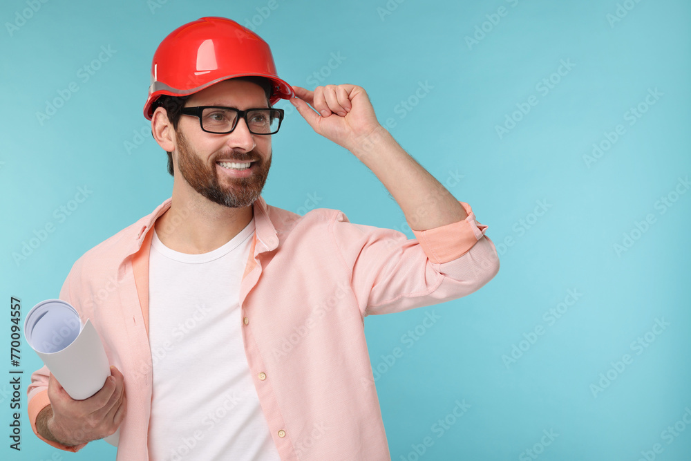 Architect in hard hat with draft on light blue background, space for text Architect in hard hat with draft on light blue background, space for text