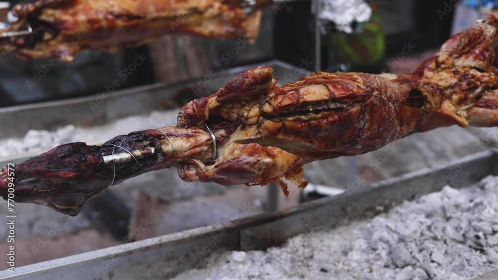 Easter in Greece, process of cooking traditional greek Easter dish - Souvla, grilled lamb, sheep and goat bbq, grilling over charcoal in the streets of Athens, Greece Easter in Greece, process of cooking traditional greek Easter dish - Souvla, grilled lamb, sheep and goat bbq, grilling over charcoal in the streets of Athens, Greece