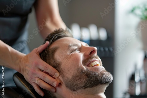 Image shows a dentist at work performing a dental examination on a male patient in a clinic