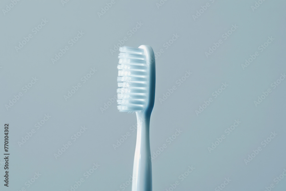 Close Up of Toothbrush on Gray Background Close Up of Toothbrush on Gray Background