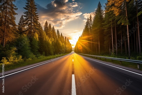 A Long Road With Sunlight Filtering Through Trees