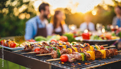 Sizzling skewers on BBQ grill with blurred crowd background, evoking the aroma and joy of outdoor BBQ gatherings photo
