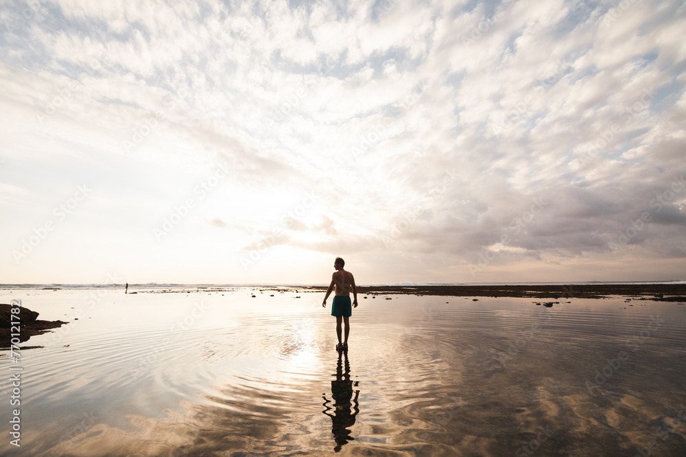Tranquil sunset walk on Indonesian beach Tranquil sunset walk on Indonesian beach