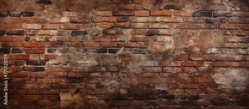 A weathered brick wall displaying a grungy and distressed look with a faded surface and aged texture