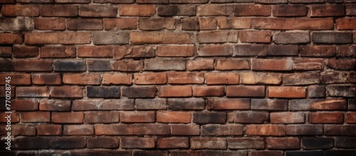 A detailed closeup of a brown brick wall showcasing the intricate brickwork  composite material  and rectangular shapes of each individual brick bonded together with mortar